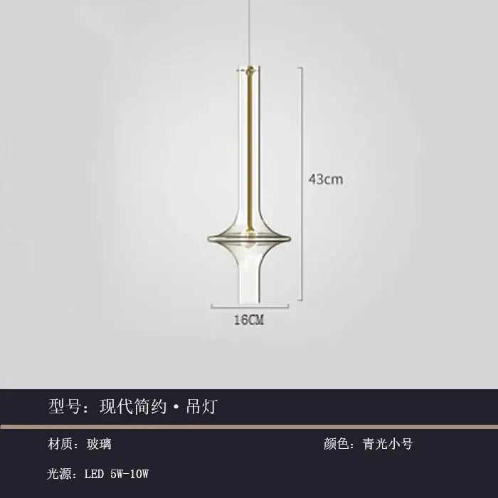 Modern minimalist glass pendant light with slender glass body and gold accents in cool blue green for kitchen use