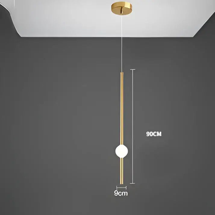 Modern minimalist gold-toned glass rod pendant light with sleek cylindrical rod and spherical bulb for living room