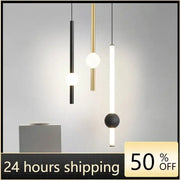 Modern minimalist glass rod pendant light in black gold and white with sleek cylindrical rods for living room use