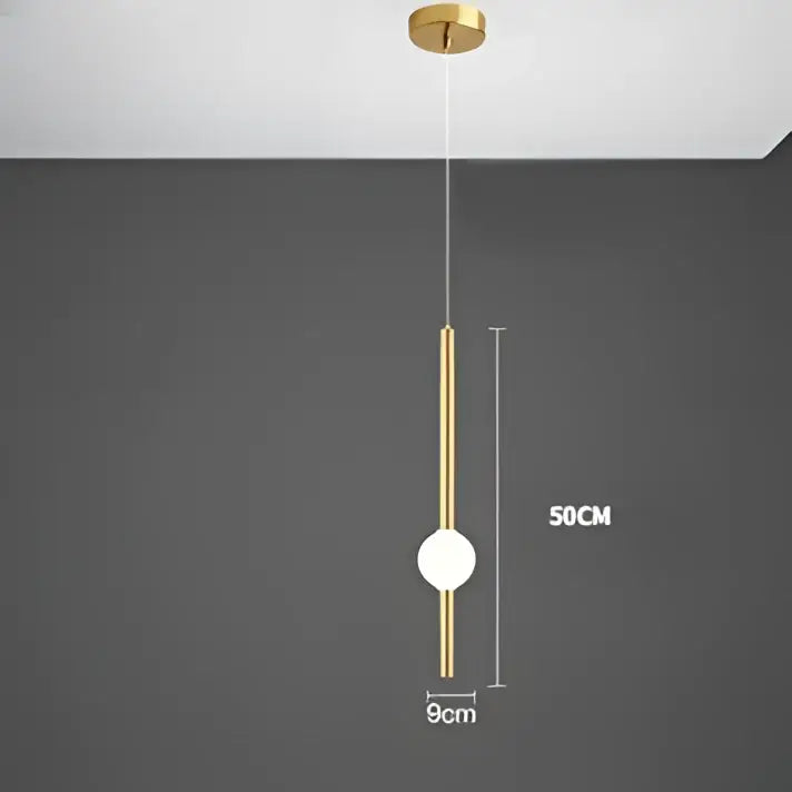 A sleek modern minimalist glass rod pendant light with a polished gold frame and white spherical bulb for living room
