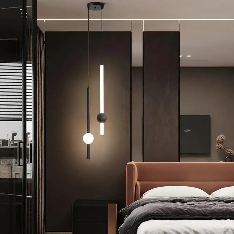 Modern minimalist black glass rod pendant light with cylindrical frame featuring vertical bar and spherical bulb for living room