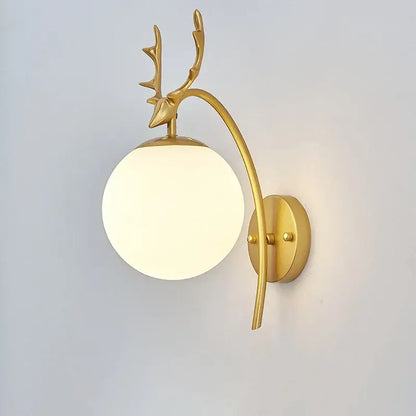 Gold-toned deer-head wall lamp with a curved arm and frosted glass shade gold for modern minimalist bedroom decor