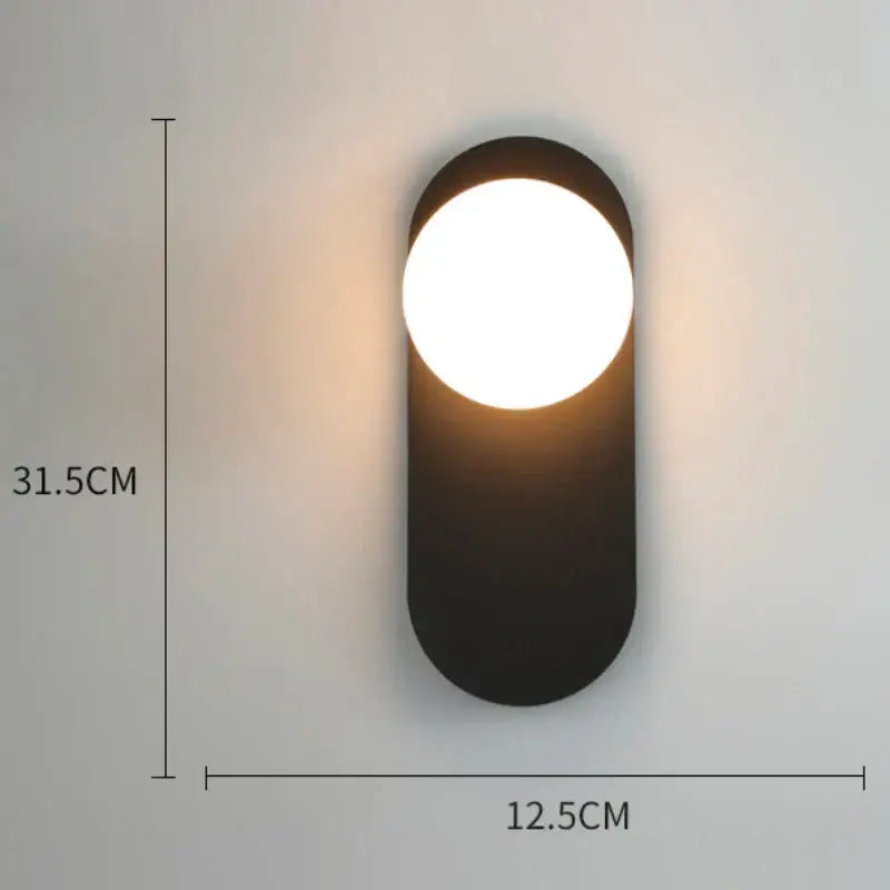Modern black oval wall lamp with warm circular glass gold led light for minimalist decorbites glass gold bedroom decor