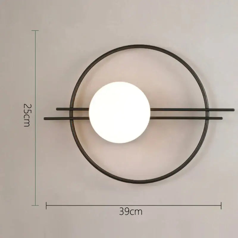 Modern minimalist wall lamp with matte black circular frame and white glowing bulb, ideal for decorbites glass gold led decor