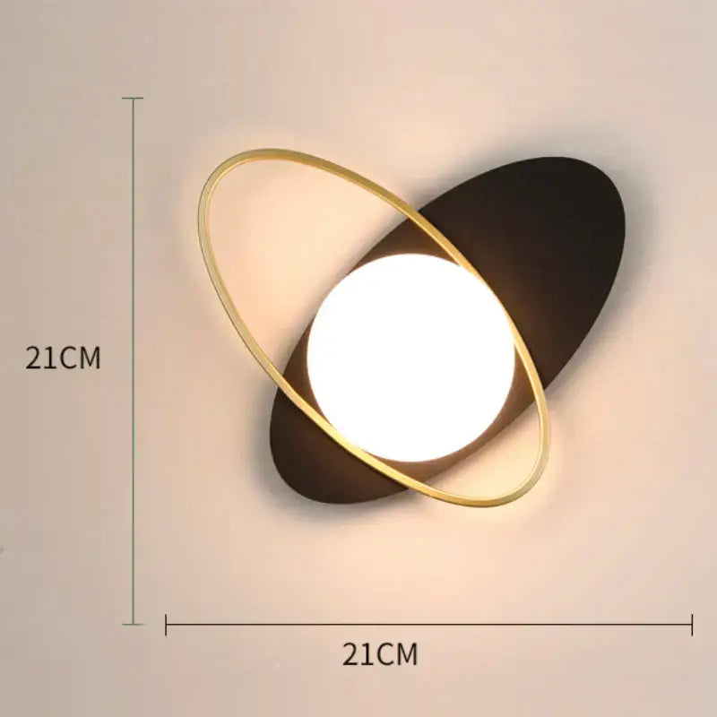Modern wall lamp with black matte base and gold-toned glass gold led ring for minimalist bedroom decorbites lighting