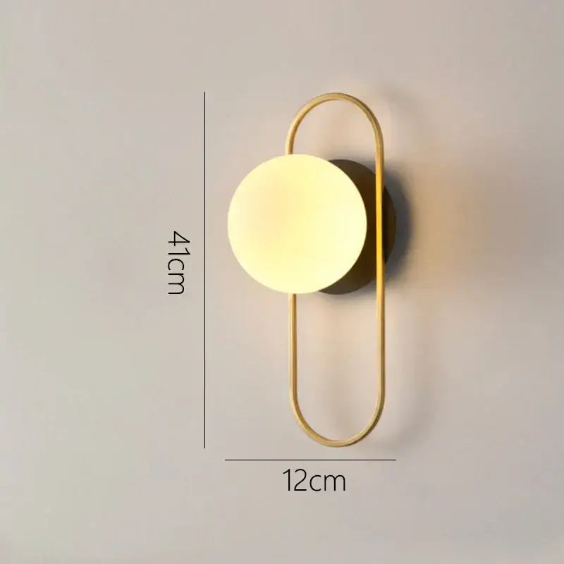 Modern minimalist gold and black glass gold led wall lamp with gold-toned metal frame and frosted glass shade for decorbites wall lamp