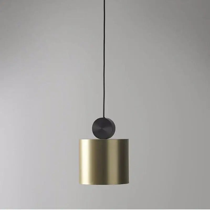 A sleek modern minimalist gold and black led pendant light with brushed gold finish for dining room decorbites golden led