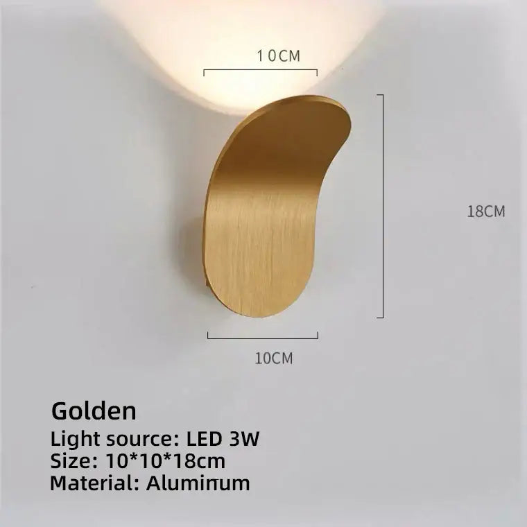 A sleek golden aluminum led wall lamp with a modern curved design for living room lighting