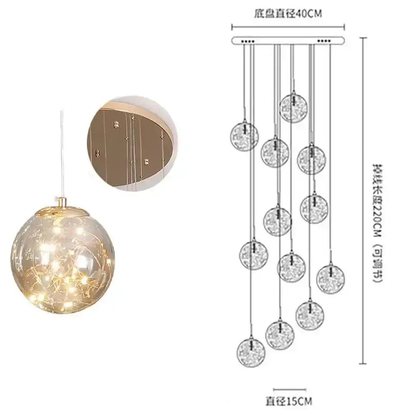 A modern minimalist decorbites glass chandelier with tiered clear glass spheres and a gold-toned ceiling mount