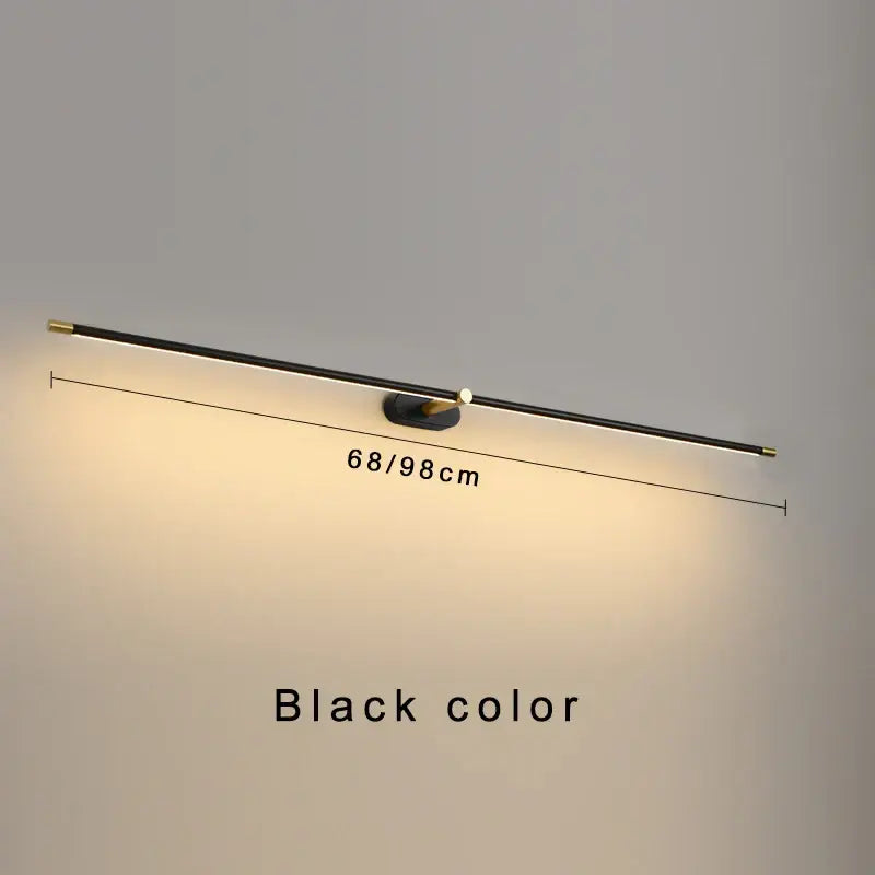 Black minimalist wall-mounted led mirror light with sleek elongated design and gold-toned accents for bathroom use