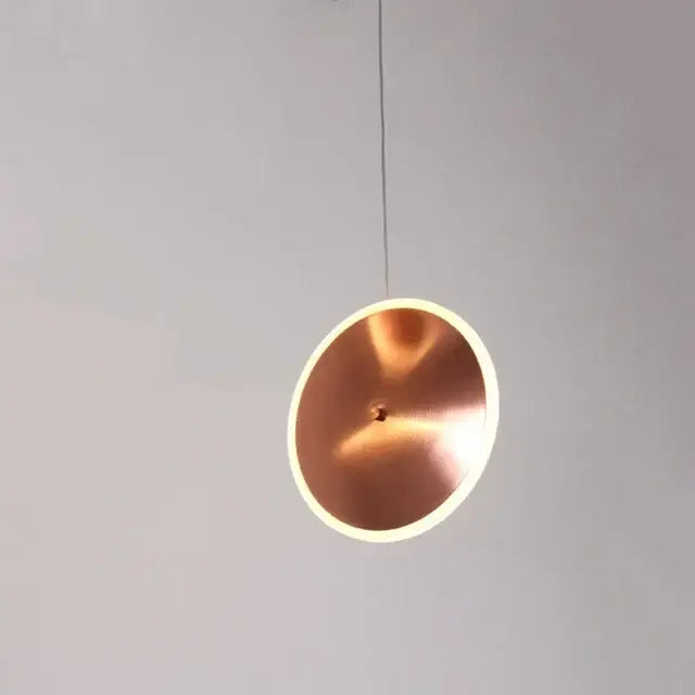 Modern minimalist copper-colored gold led pendant light with sleek design and softly glowing edge for kitchen island decorbites gold led