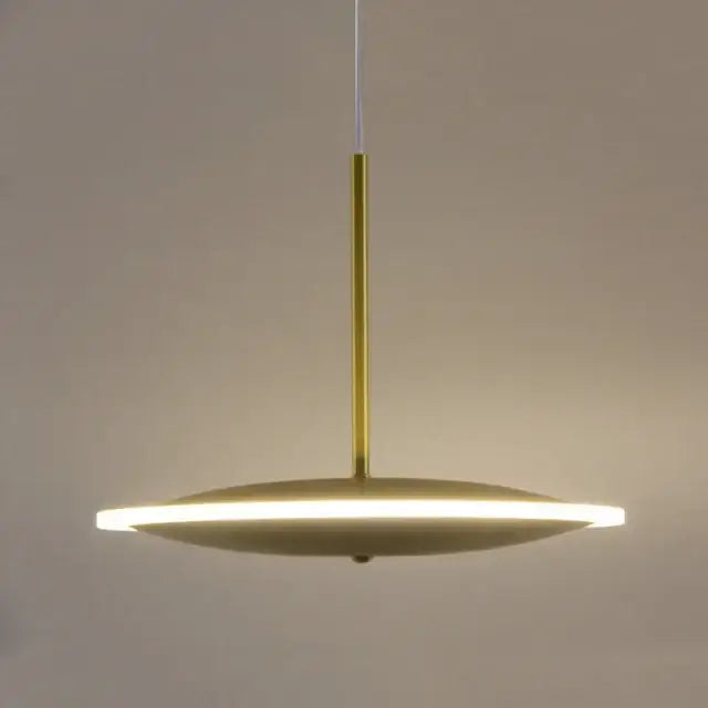 Modern minimalist gold led pendant light with sleek disc-shaped design and illuminated edge for kitchen island decorbites gold led pendant