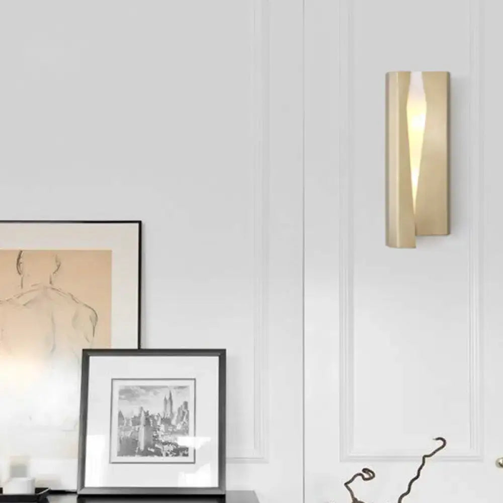 Modern minimalist gold metal rectangle wall sconce light with sleek vertical ridges for living room use