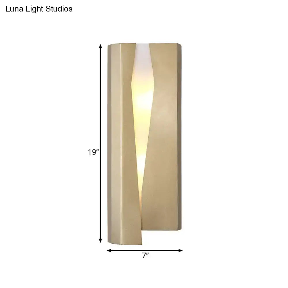Modern minimalist metal rectangle wall sconce light with brushed gold finish and warm ambient vertical slit illumination