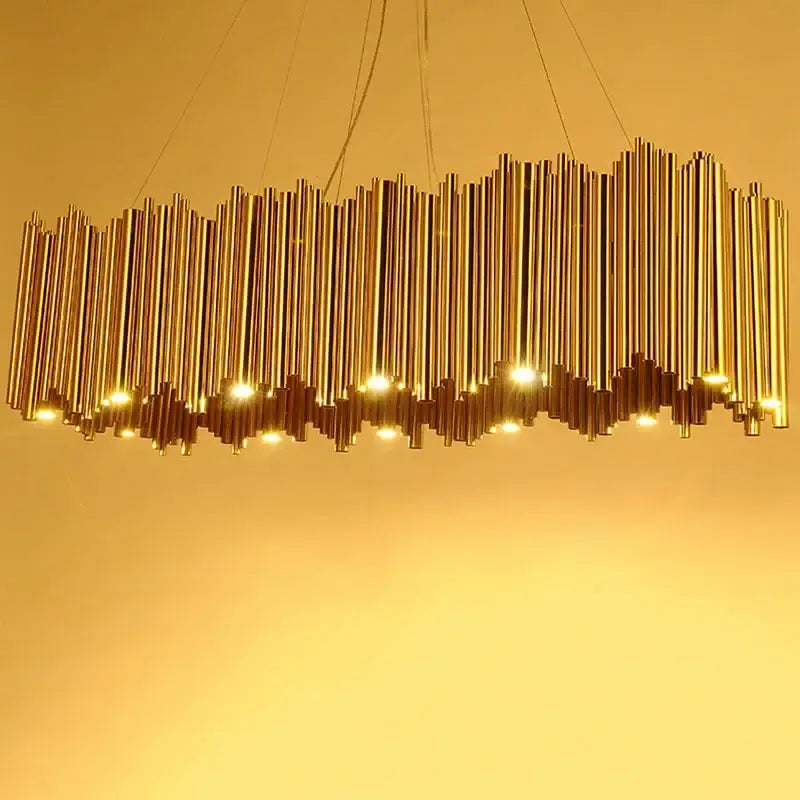 Modern minimalist gold stainless steel chandelier with wavy vertical rods and embedded lights for living room decorbites gold stainless