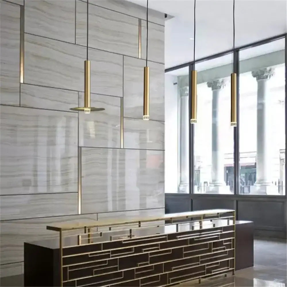 Modern minimalist gold tube led pendant lights with sleek cylindrical design for kitchen dining room decorbites gold tube