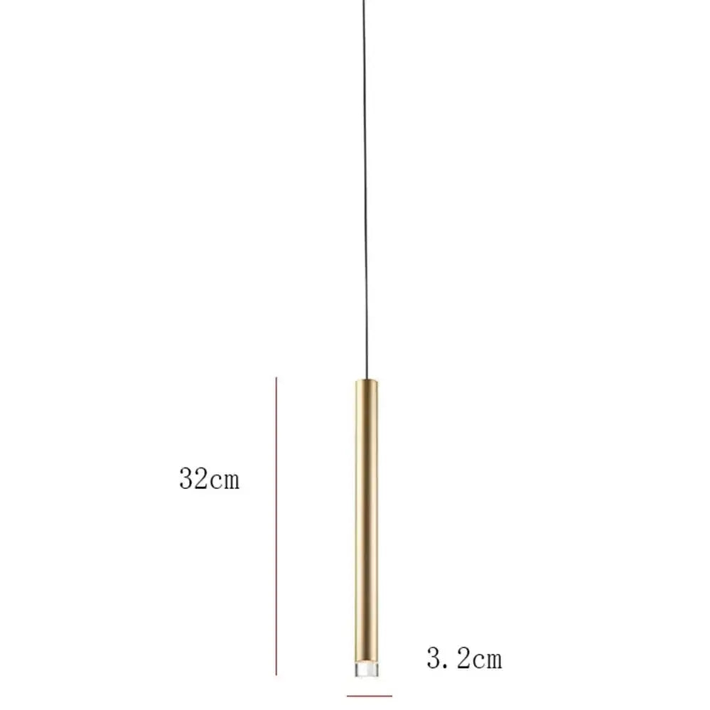 A sleek modern minimalist gold tube led pendant light with a cylindrical brass body and clear glass base for kitchen decor