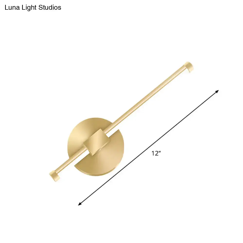 Modern minimalist gold tube stick wall sconce with gold finish, circular base, and elongated arm for bedroom led light