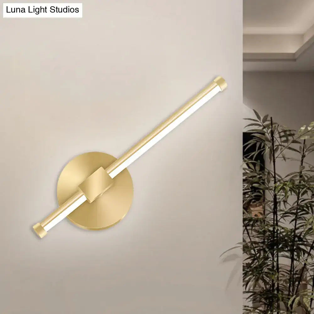 Modern minimalist gold tube stick wall sconce with sleek elongated led light bar on circular base for bedroom lighting
