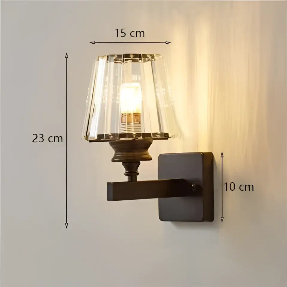 Vintage-style modern minimalist wall sconce with dark bronze finish and faceted crystal shade for bedroom lighting
