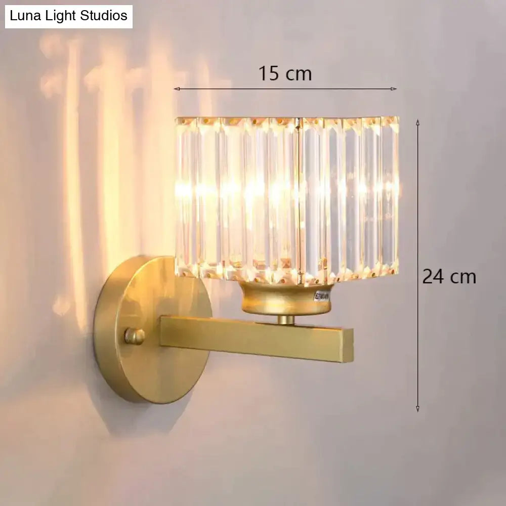 Modern minimalist gold wall lamp with cylindrical crystal shade of vertical glass rods for bedroom lighting