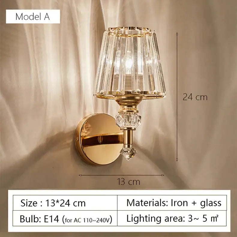 Modern minimalist wall lamp featuring a gold-toned finish with faceted crystal glass shade and decorative crystal accents