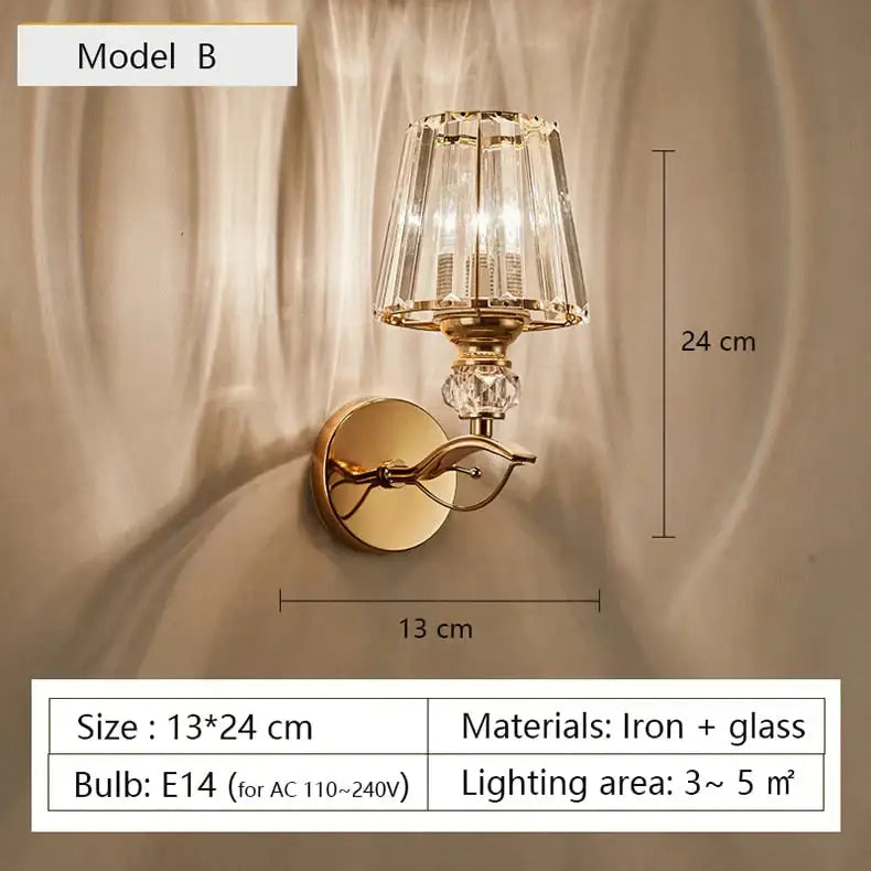 Modern minimalist gold-toned wall sconce with faceted crystal shade and decorative glass elements for bedroom use