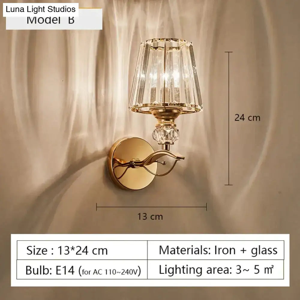 Modern minimalist gold wall lamp with faceted crystal shade and decorative glass elements for bedroom use