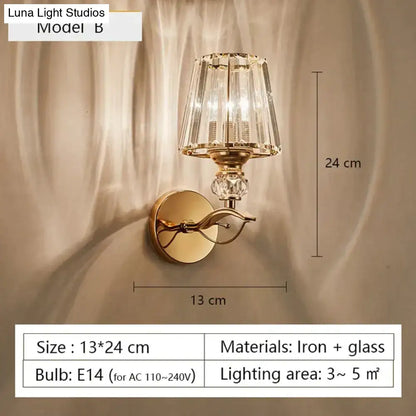 Modern minimalist gold wall lamp with faceted crystal shade and decorative glass elements for bedroom use