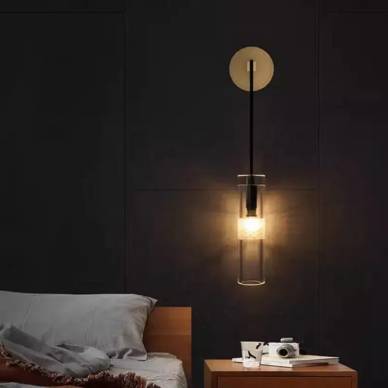 Modern minimalist wall lamp with circular brass backplate and clear glass shade for decorbites golden glass wall decor