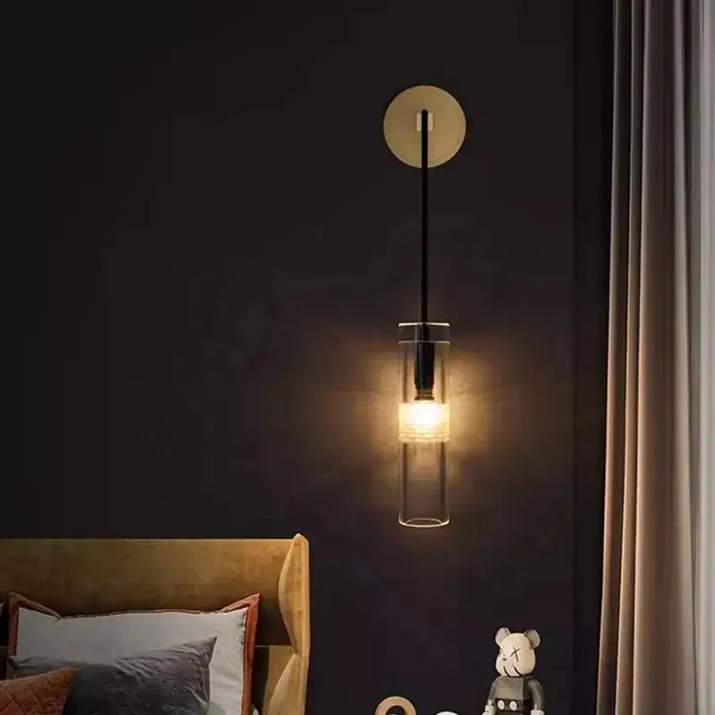 Modern minimalist golden glass wall lamp with beige circular backplate and black stem decorbites golden glass wall lamp