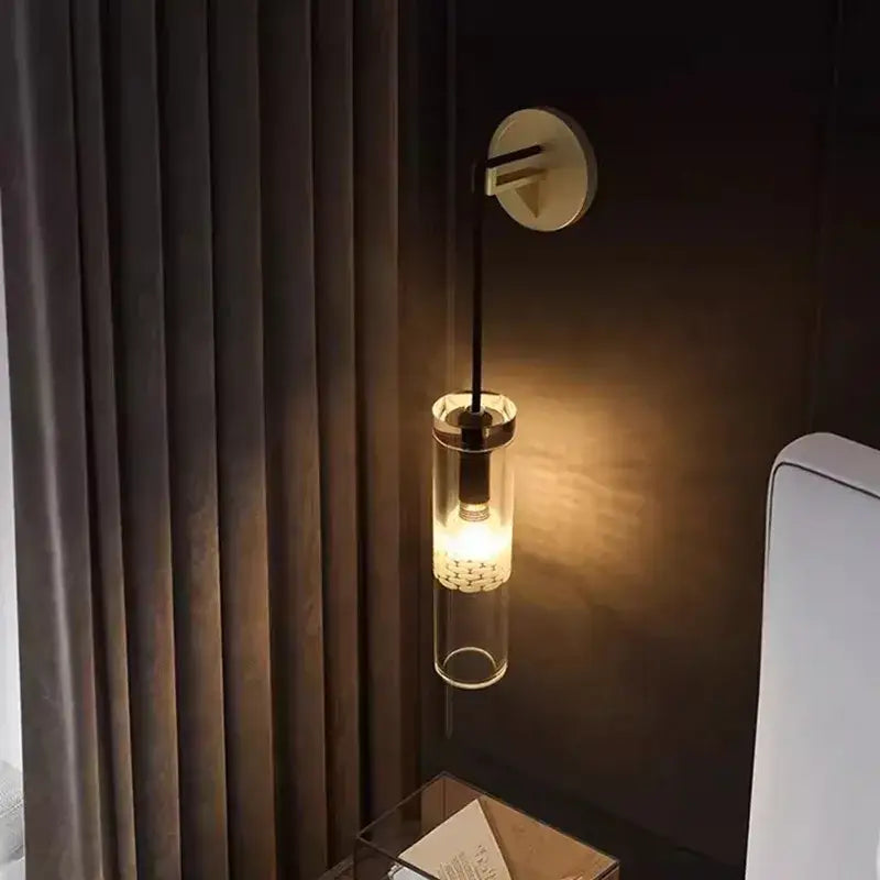 A sleek modern minimalist golden glass wall lamp with warm glow and metallic accents for living room decorbites golden glass
