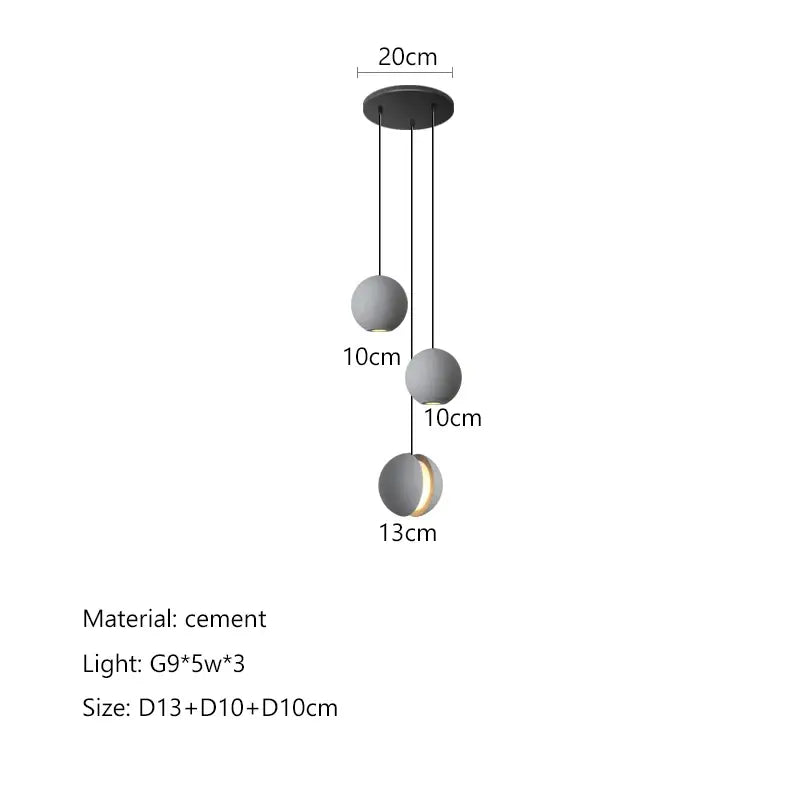 Modern minimalist pendant light with three matte gray cement planet chandelier shades by decorbites for dining room decor
