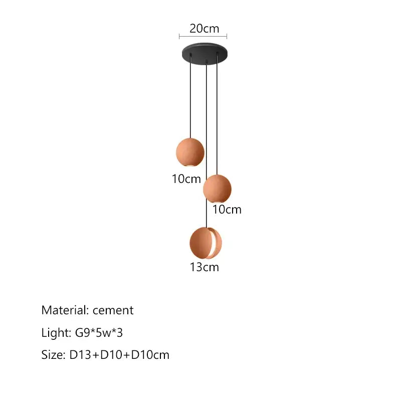 Modern minimalist pendant light with three terracotta cement shades suspended from black mount decorbites cement planet chandelier