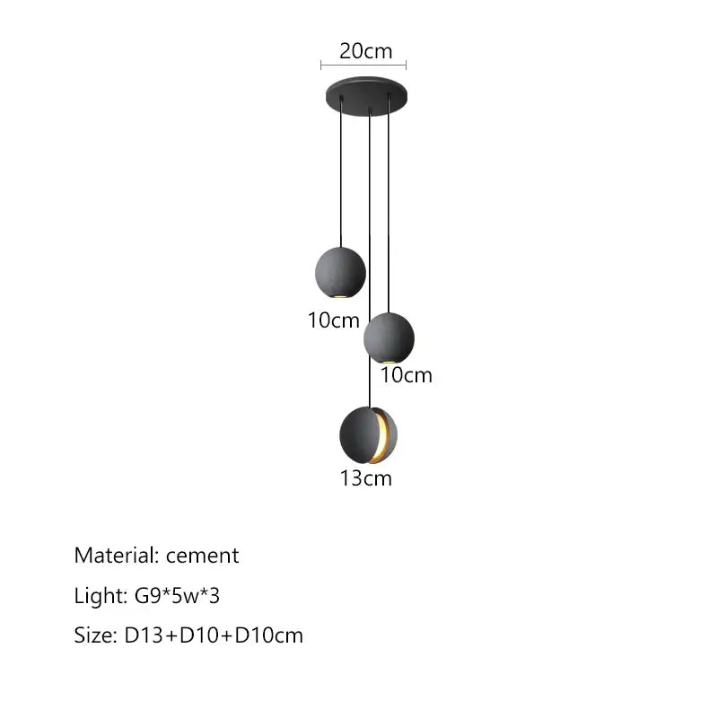 Modern minimalist pendant light with three matte black cement shades and gold accents for dining room decorbites cement planet chandelier