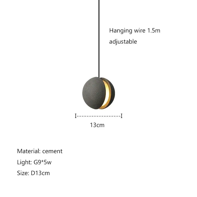 Modern minimalist gray and gold pendant light with matte black cement body and warm gold ring from decorbites cement planet chandelier