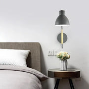 Modern minimalist gray e27 bulb wall sconce with gold accent rod and circular base for bedroom lighting