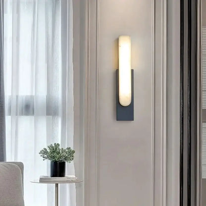 Modern minimalist grey metal wall sconce with sleek frosted glass diffuser for bedroom lighting by decorbites grey metal