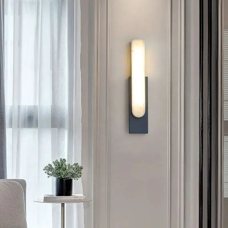 Modern minimalist grey metal wall sconce with sleek frosted glass diffuser for bedroom lighting by decorbites grey metal