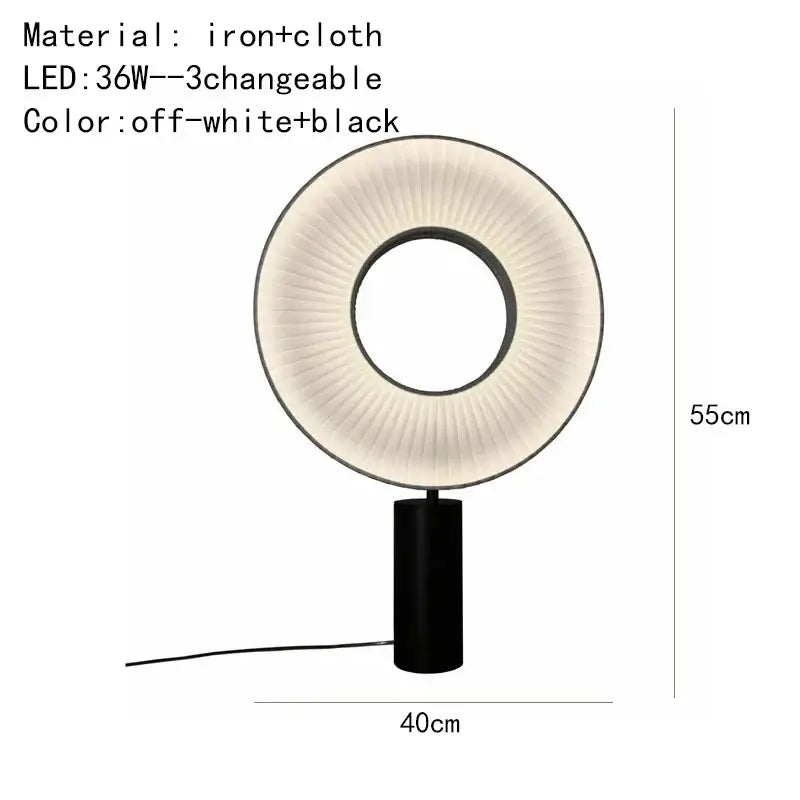 Modern minimalist dix iris pendant light with black iron base and pleated off-white cloth ring emitting soft light