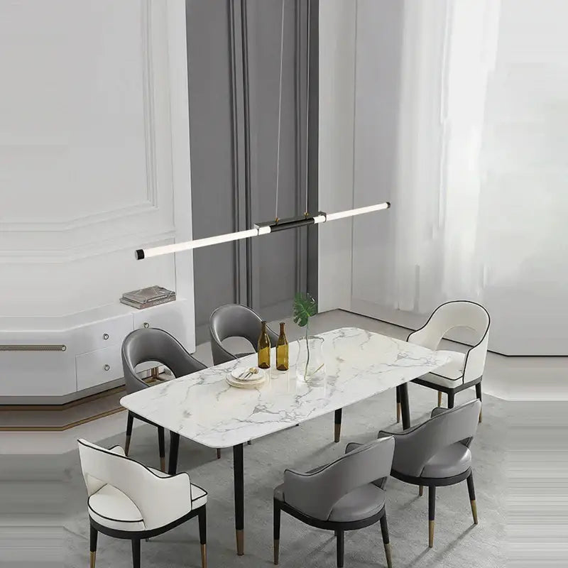 Modern marble dining table with sleek black legs paired with led black gold designer chandelier for elegant decorbites decor