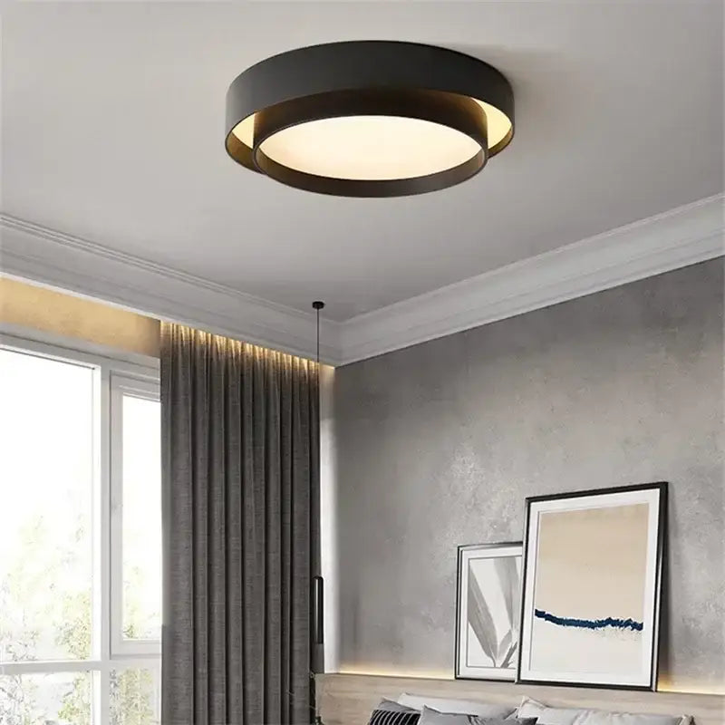 Modern minimalist black circular led ceiling light with warm glow for bedroom lighting and elegant ceiling light design
