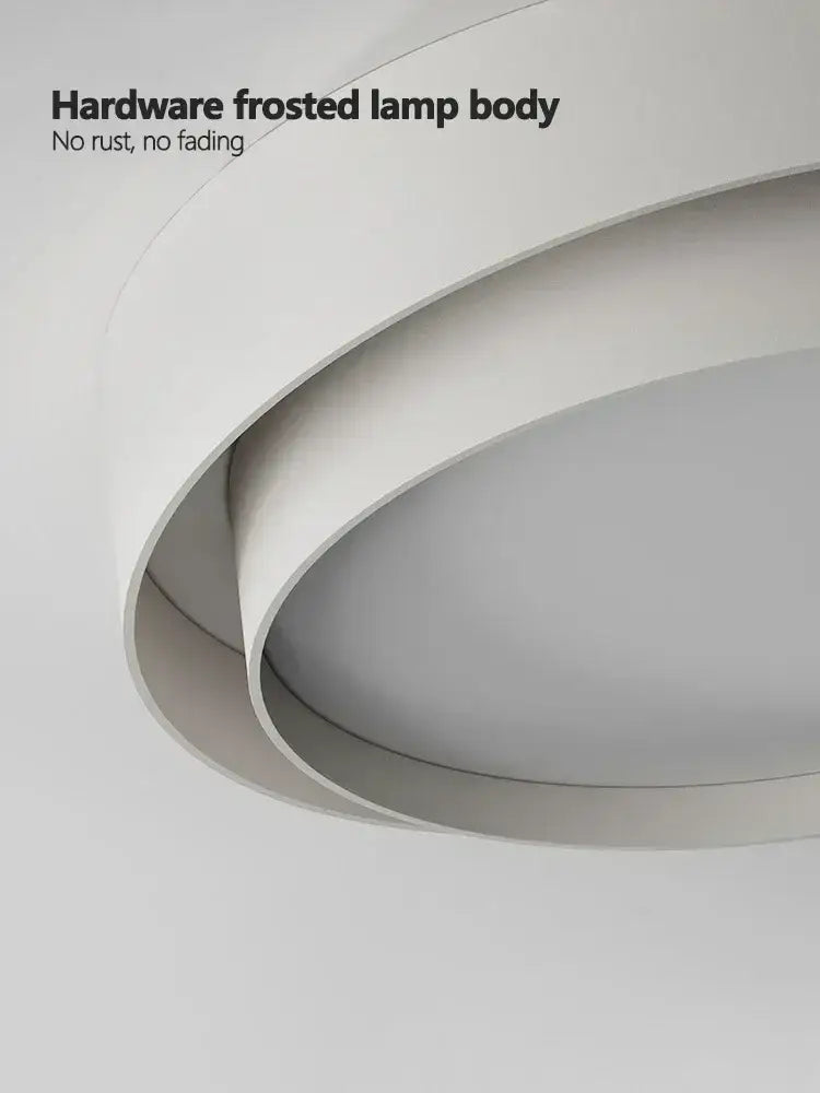 White frosted hardware led ceiling light with sleek layered circular design for modern minimalist bedroom lighting