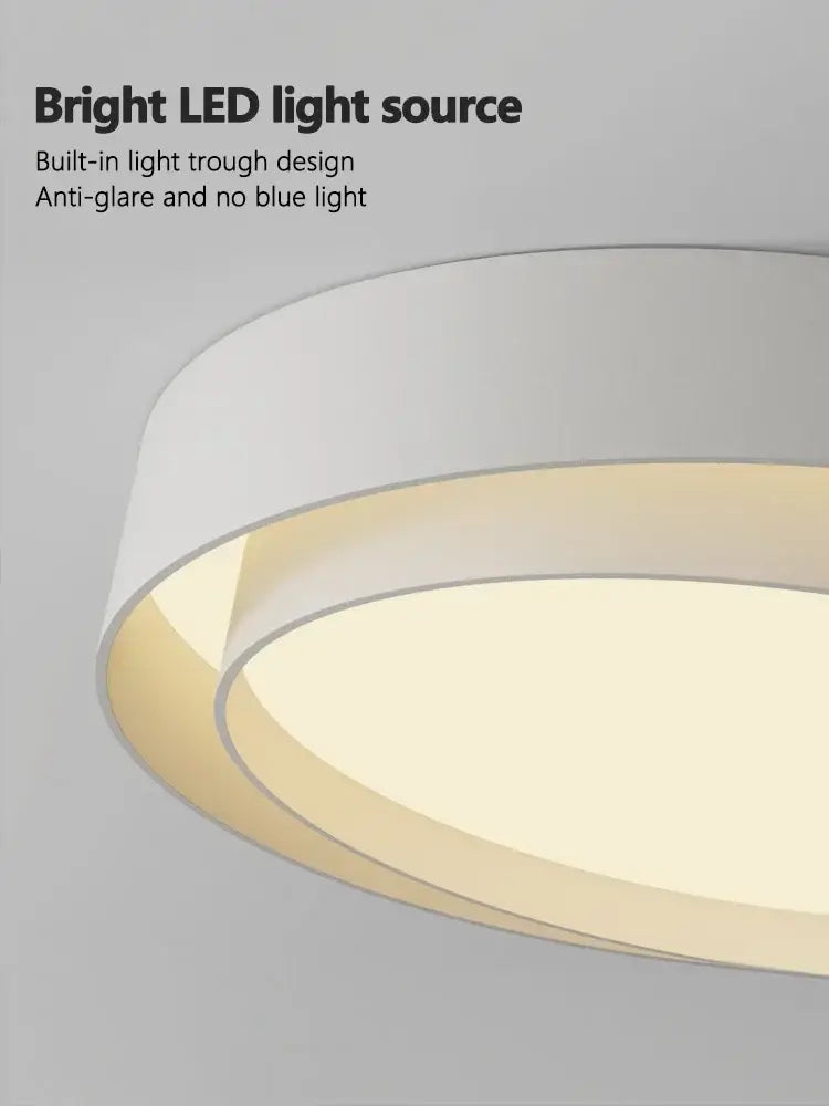 Modern minimalist white and black led ceiling light with sleek layered design and warm illumination for bedroom lighting
