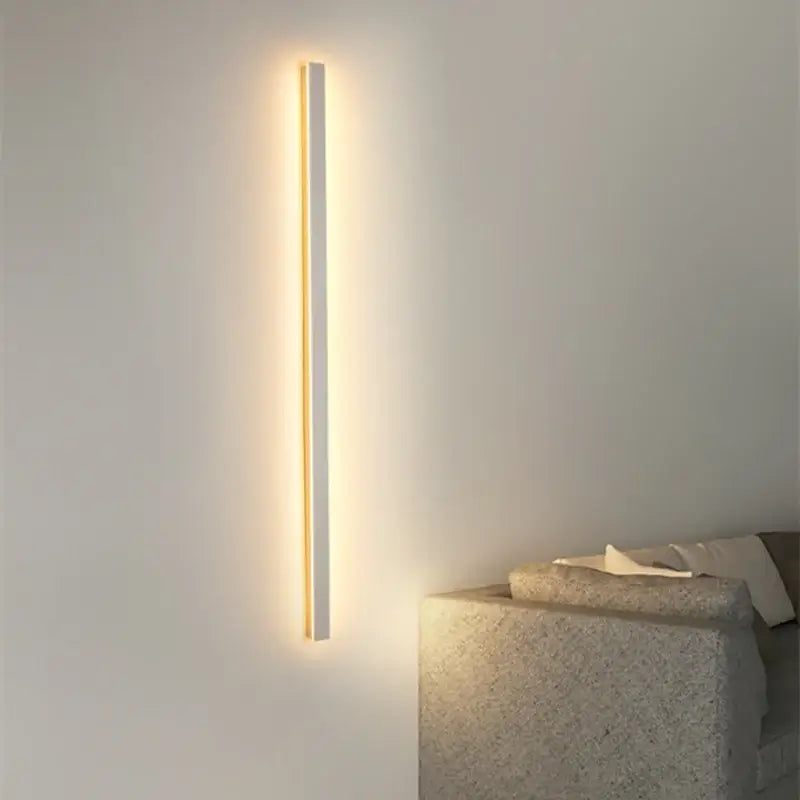 A sleek modern minimalist led white wall lamp by decorbites with slim rectangular design and warm ambient glow