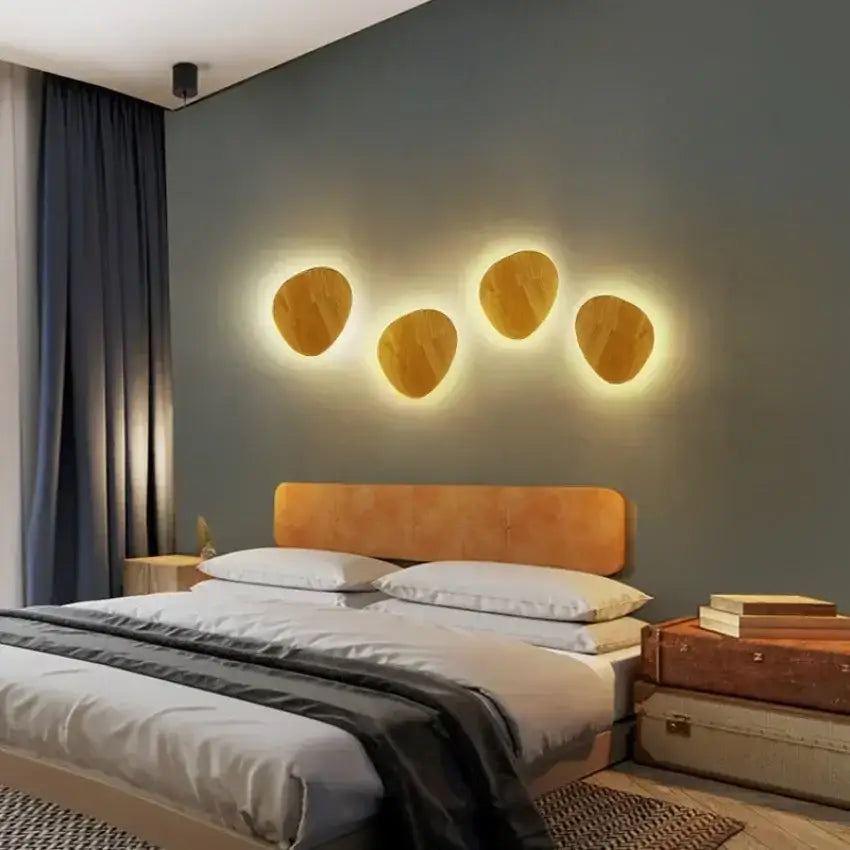 Four warm-toned oval led wooden wall lights with wood-grain finish emit soft light for modern minimalist living room decorbites wall lights