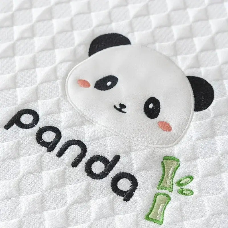 Modern minimalist light green panda sofa mat with white quilted fabric and embroidered panda face for living room use