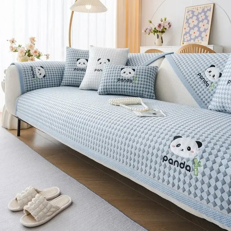 Modern minimalist light green woven sofa cover with embroidered panda faces and black panda lettering for living room use