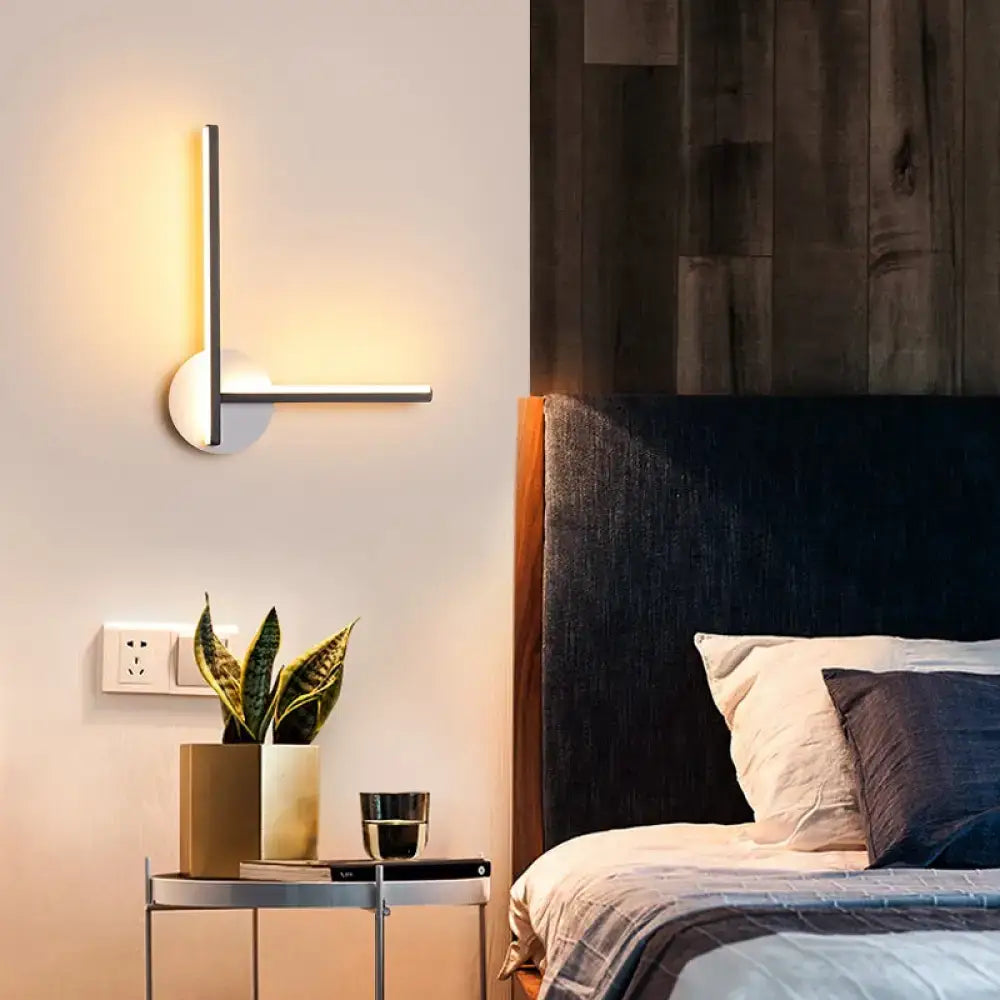 Modern minimalist linear wall light fixture with brushed metal finish and warm led lighting for bedroom use