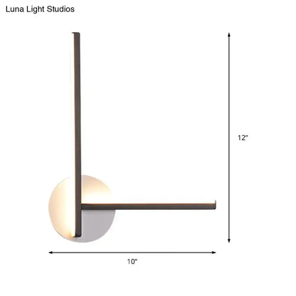 Modern minimalist linear wall light fixture with sleek black metal frame and warm LED light for bedroom use